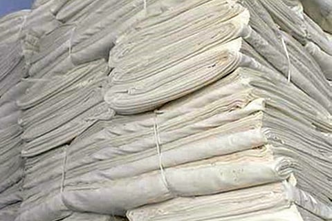 Huge bundles of stagnating rayon fabric at a power loom unit in Erode