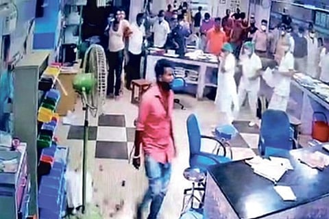 One of the youth (pink shirt) seen causing damage in the video grab