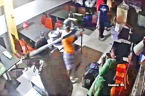 Screengrab of the cop assaulting customers