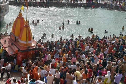 Devotees gather at Har Ki Pauri ghat to offers prayers during Kumbh Mela 2021, in Haridwar
