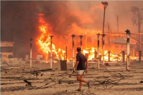 A glimpse of the fire at a beach in Catania (Credit: Reuters)