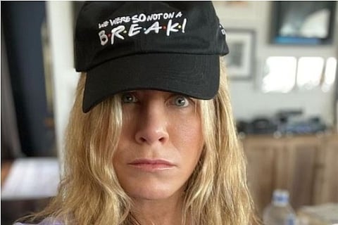 Jennifer Aniston wears a cap showing Ross and Rachel were not on a break (Source: Instagram)