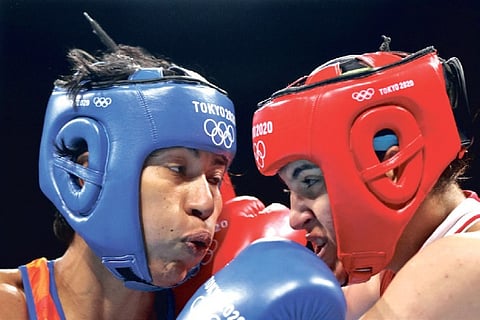 Lovlina Borgohain (in blue) finished second best in the semi-final duel against Turkey?s Busenaz