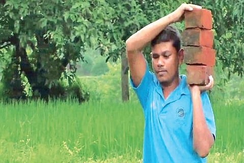 Naresh Tumda doing labour work in Gujarat?s Navsari