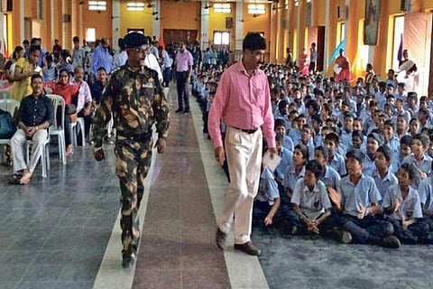 Conman Vijayan (in Army uniform) being received at a school function