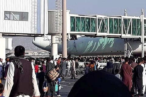 Afghans clinging to side of US military aircraft as it prepares to take off