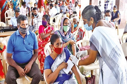 Teachers being vaccinated at Manthope Girls Higher Secondary School, Saidapet, on Friday