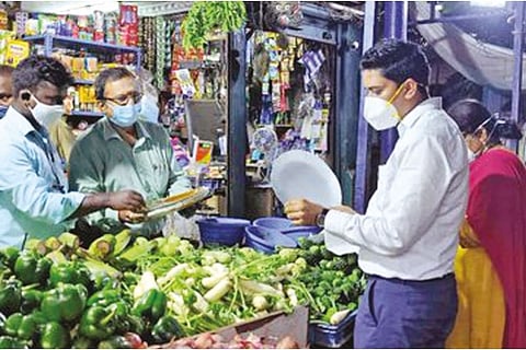 File photo of officials seizing banned plastic items from shops in city
