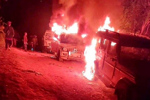 Vehicles set ablaze during the riots