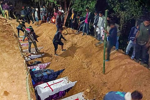 Coffins of the 13 people, who were allegedly killed by Armed Forces, buried during their funeral