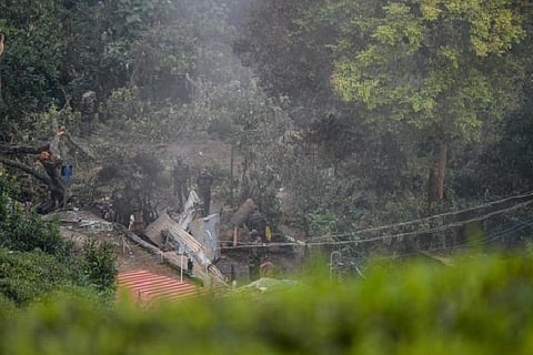 Army personnel carry out an investigation procedure at the crash site in Coonoor, TN (Credit: AFP)