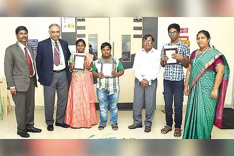 Differently abled children K Vijay, A Ravi Varma and T Hemavarshani being felicitated in SRM OT