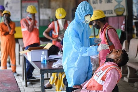 A health worker taking RT-PCR test (Image credit: PTI)