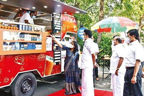 Stalin looking at tea produces on display after flagging off tea vending vehicles in Chennai