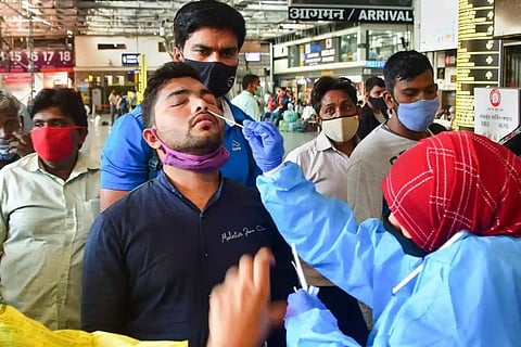 A health worker taking RT-PCR test (Image credit: PTI)