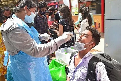 A health worker taking RT-PCR test (Image credit: PTI)