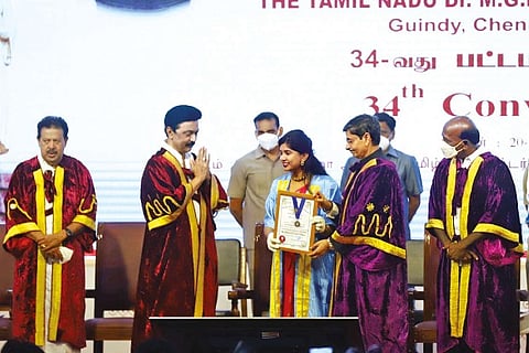 MK Stalin greets a medical graduate as TN Governor and Chancellor RN Ravi confers her with degree