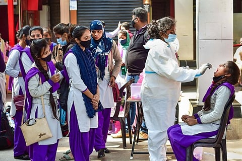 School students get RT-PCR test from a Healthcare worker