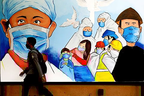 Promoting the use of protective face masks amidst the Omicron variant (Credit: Reuters)