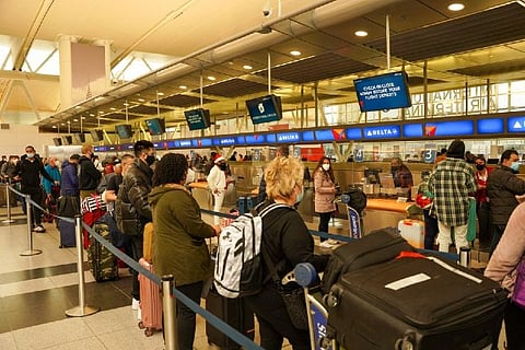 Passengers at John F. Kennedy International Airport after airlines cancels flights (Reuters)