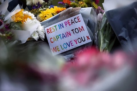 Britain mourns 'hero' Captain Tom Moore with flowers and lights