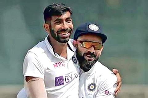 Jasprit Bumrah (left) with India captain Virat Kohli