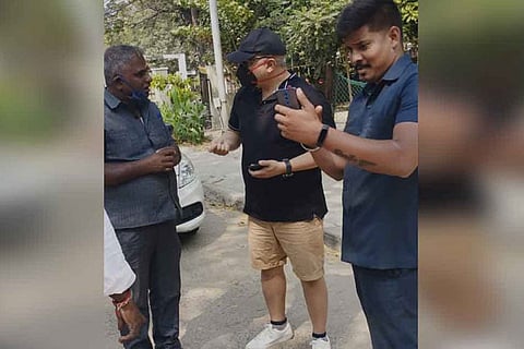Ajith Kumar with security officials of Commissioner's office on EVK Sampath Road in Vepery