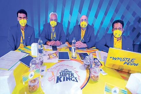 CSK bowling coach Lakshmipathy Balaji (left) with management officials at the auction table