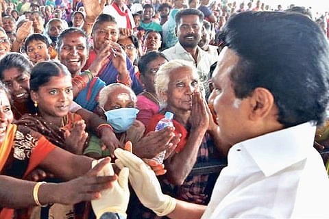 DMK president MK Stalin being welcomed by women at a campaign venue in Theni district on Thursday
