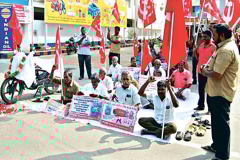 CPM members staging protest against fuel price hike in Tiruchy on Friday