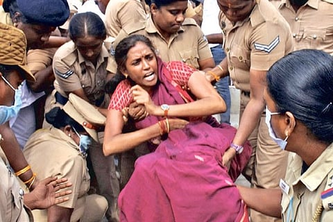 Congress MP Jothimani protesting in Karur on Saturday