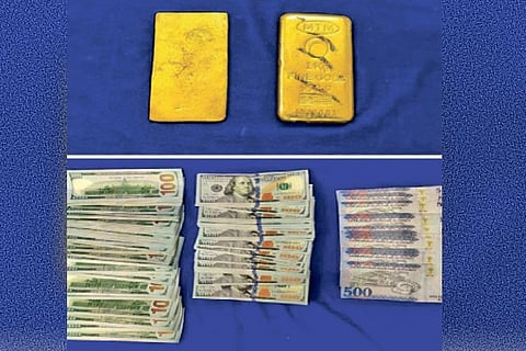 Seized gold bars and foreign currency