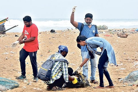 Volunteers collect garbage at Pattinapakkam beach