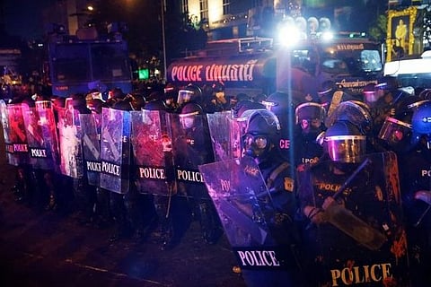Thai protesters, police clash near base of army unit king controls