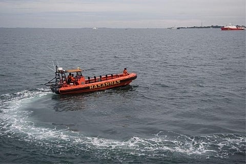 Source: Reuters; A Rescue boat in search of debris