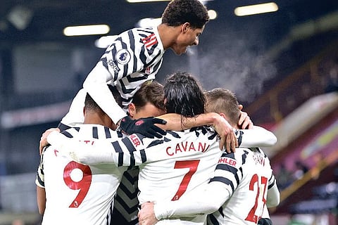 Manchester United players celebrate their win over Burnley