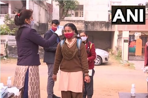 Smiles, sanitizers welcome students as schools reopen in Delhi