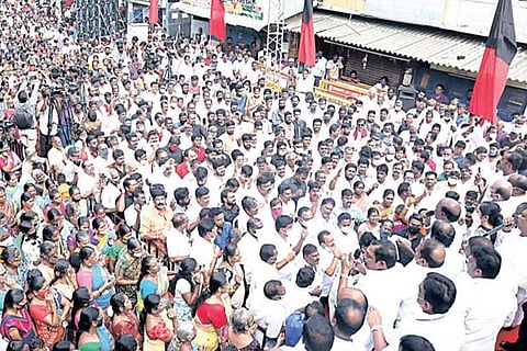 DMK workers staging a protest in Chennai demanding restoration of Velachery lake on Thursday