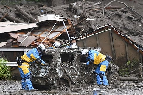 Japan searches for dozens missing in resort town mudslide