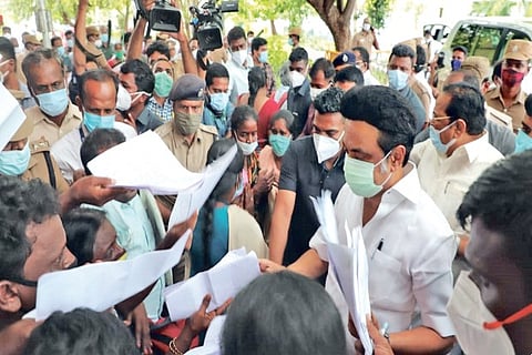 Petitioners crowding around Chief Minister MK Stalin to submit their grievances at the Secretariat