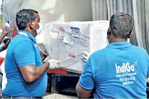 Staff unloading 4.8 lakh doses of Covishield that reached the city