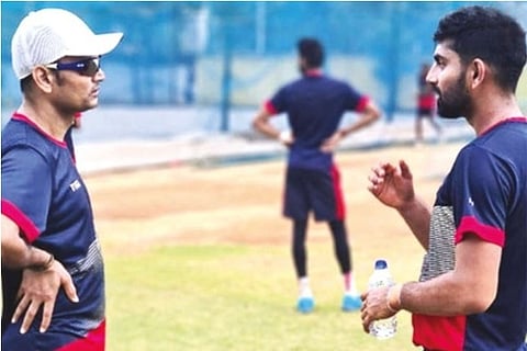CSG coach Hemang Badani (left) has a chat with Narayan Jagadeesan during a training session