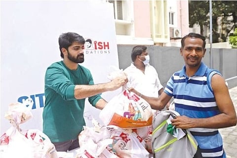 Shirish (left) during the vaccination camp
