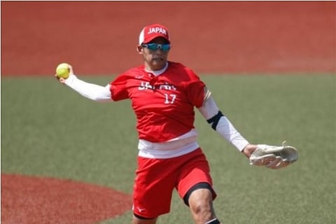 Japan's Yukiko Ueno throws a pitch against Australia in the softball opening round (Source: Reuters)