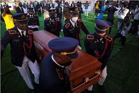Dressed as military pallbearers carry the coffin of Late President Jovenel Moise (Credit: Reuters)