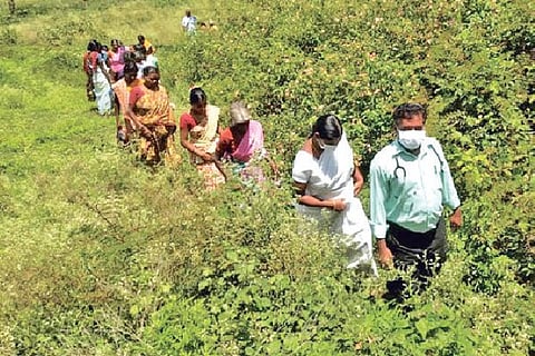 Health officials trekking to a tribal hamlet in Tirupattur