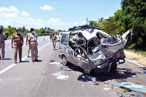 Police removing the mangled remains of the vehicle involved in the accident in Krishnagiri district