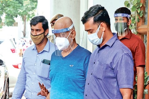 Siva Shankar Baba being taken for questioning on Thursday