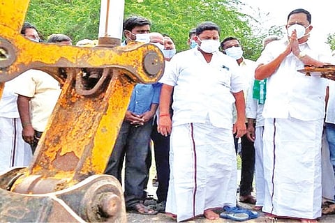 Handloom Minister R Gandhi participating in a pooja to start desilting work on a canal in Thangal