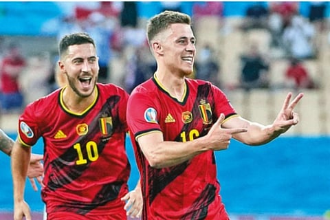 Belgium wing-back Thorgan Hazard celebrates after scoring